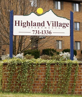 Highland Village Apartments sign